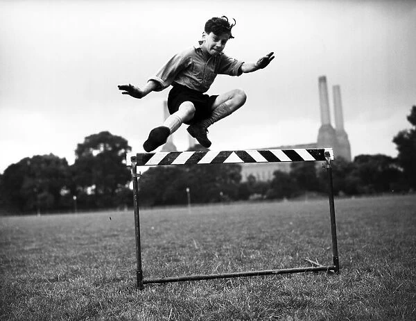 Peter Saunders training for sport at Battersea athletic track. 19th August 1954