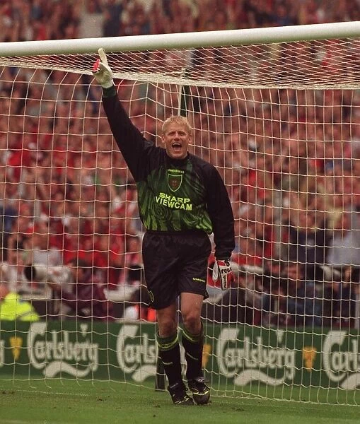 Peter Schmeichel Manchester United goalkeeper celebrates after saving penalty kick during