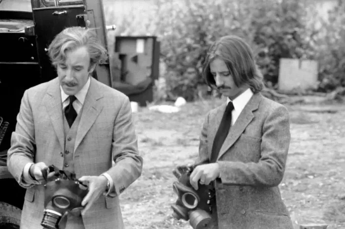 Framed Print : Peter Sellers and Ringo Starr prepare to put on gas masks in a scene from the film