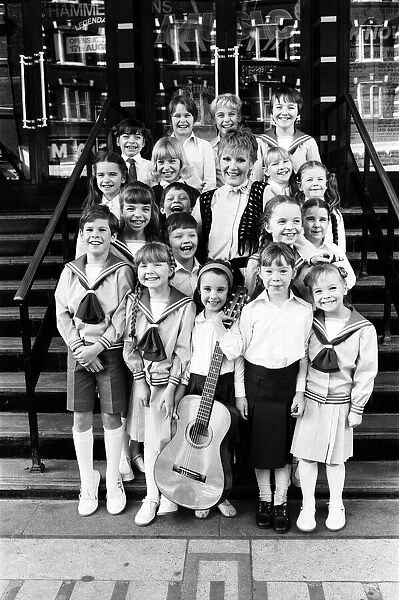 Petula Clark with the final selection of 18 children, three groups of six