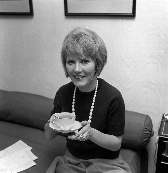 Petula Clark holding a cup of tea. April 1964 She