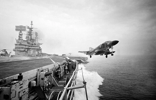 A Phantom aircraft takes off from the new angled flight deck of HMS Ark Royal in
