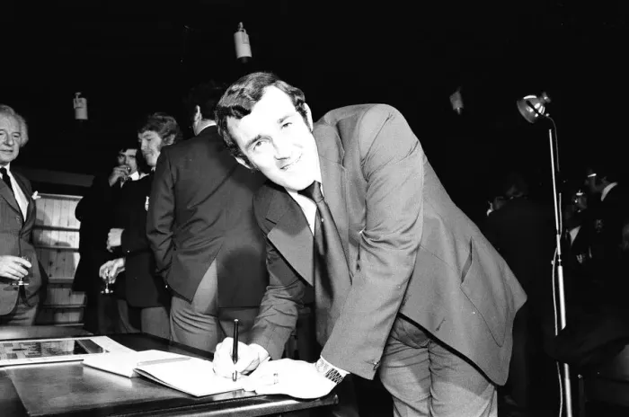 Framed Print : Phil Bennett signing the visitors book at the International Sports Writers Club in Great Framed Print : Phil Bennett signing the visitors book at the International Sports Writers Club in Great