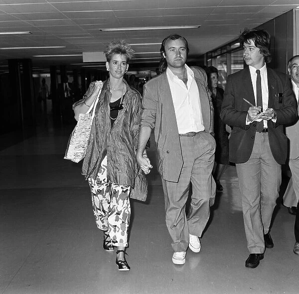 Phil Collins and his wife Jill at LAP to catch a flight to Greece. 1st September 1985