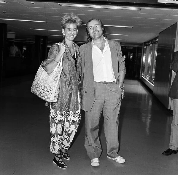 Phil Collins and his wife Jill at LAP to catch a flight to Greece. 1st September 1985