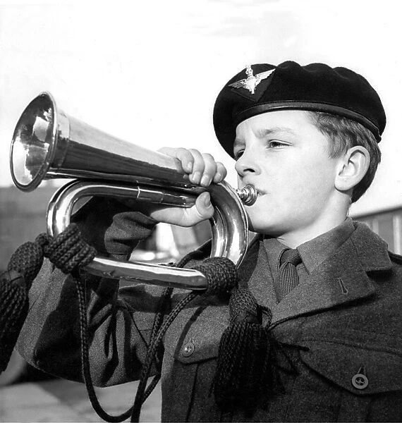 Philip Hall getting a tune from his copper bugle in December 1962
