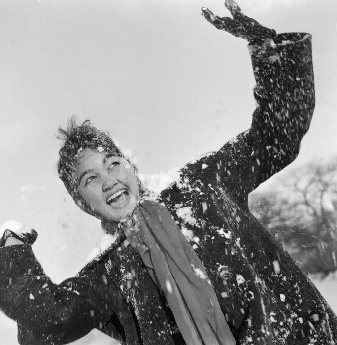 Framed Print : Philippine dancers have a snowball fight in London. One of the woman throwing