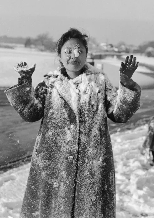 Framed Print : Philippine dancers have a snowball fight in London. One of the woman throwing