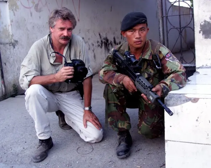 Framed Print : Photographer Mike Moore with Gurkha soldier on patrol in Dilli Framed Print : Photographer Mike Moore with Gurkha soldier on patrol in Dilli