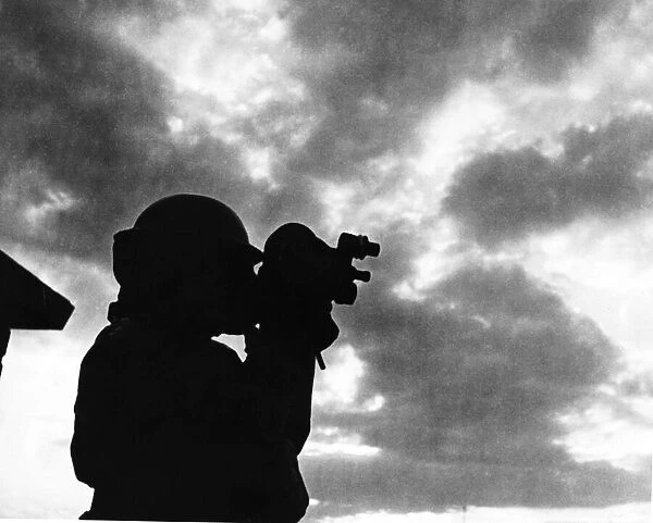 Photographer on a roof in WW2