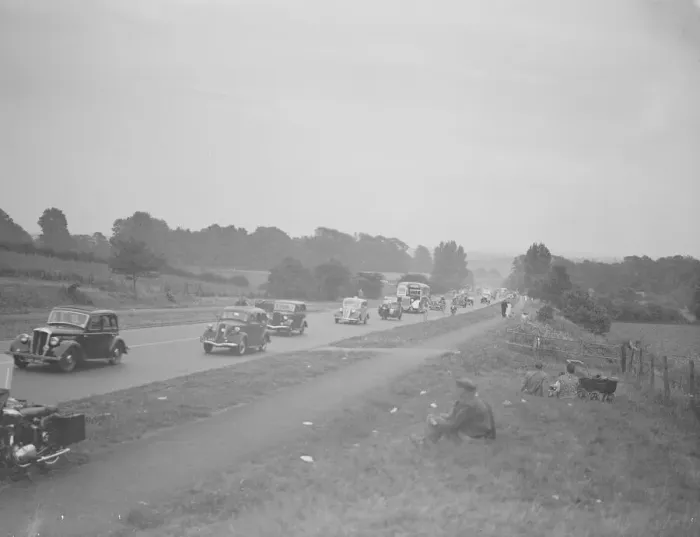 Framed Print : Picnickers sit on the verge watching the traffic on the Sidcup by-pass Framed Print : Picnickers sit on the verge watching the traffic on the Sidcup by-pass