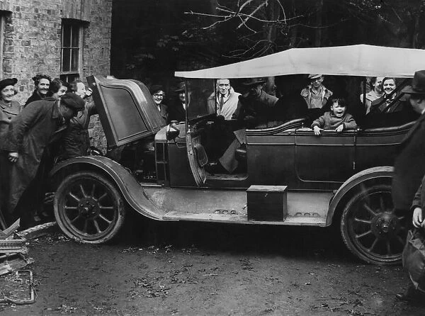 Picture shows crowds examining a 1910 Arrol Johnston 13. 9 h. p. car