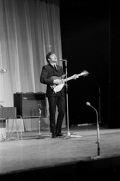 Picture shows John Lennon. The Beatles rehearse at The Prince of Wales Theatre in