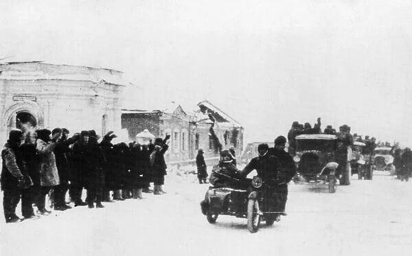 Picture shows: The population of a liberated village welcoming Red Army soldiers who