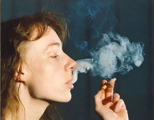 A picture of a woman (Posed model) smoking