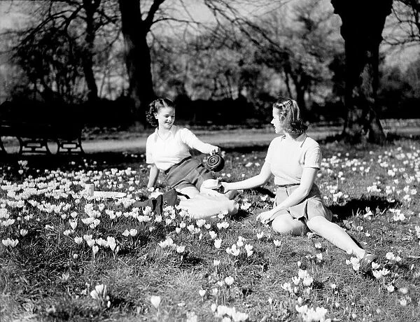 Picture show two young ladies enjoying the sunshine in the summer of 1948