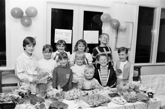 Framed Print : Pictured at their cake stall are these Thurstonland youngsters who have raised 100 for Framed Print : Pictured at their cake stall are these Thurstonland youngsters who have raised 100 for