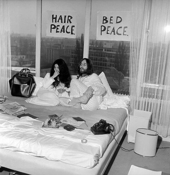 Pictured on their 'honeymoon'bed newly weds. John Lennon