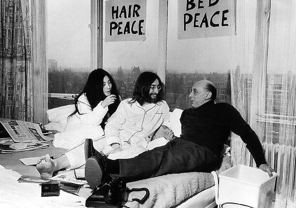 Pictured on their 'honeymoon'bed newly weds John Lennon