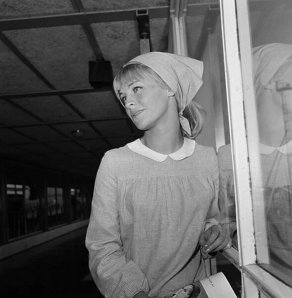 Pictured leaving London Airport for Rome is actress Julie Christie