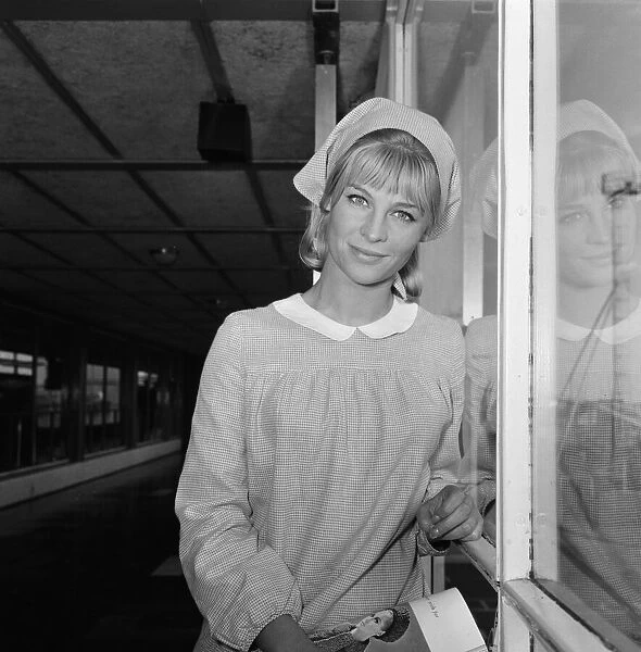 Pictured leaving London Airport for Rome is actress Julie Christie