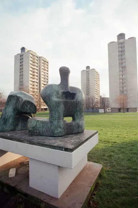 Framed Print : Two Piece Reclining Figure No 3 sculpture by Henry Moore. General views of tower blocks