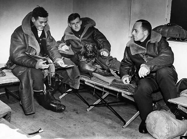 Pilots of an RAF night fighter squadron relaxing as they stand by for the order to take