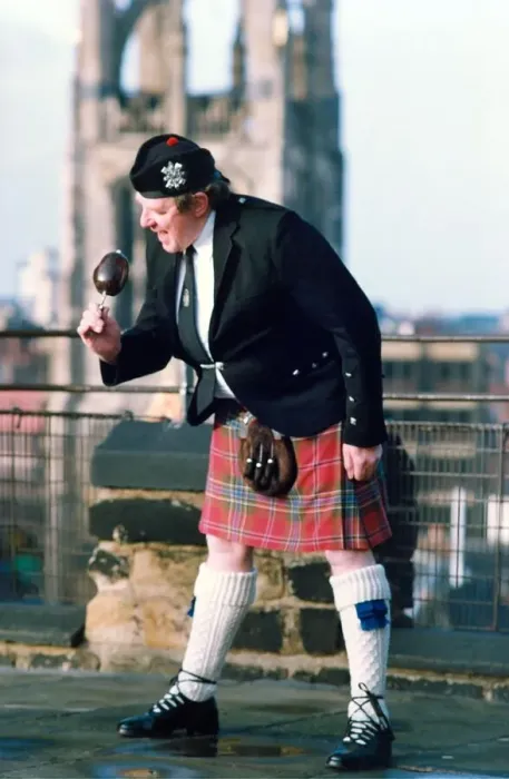 Framed Print : Piper Derek elliott samples a locally grown haggis in January 1994