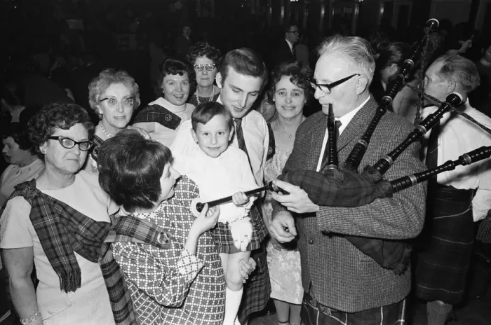 Framed Print : Piper plays for a small group of people attending a New Years Dance at the Regis Hall Framed Print : Piper plays for a small group of people attending a New Years Dance at the Regis Hall