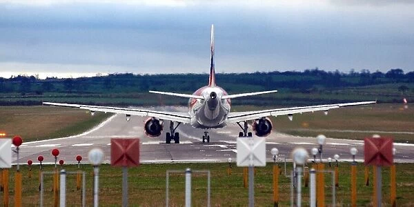 A plane takes off on a runway over Callerton Hill from Newcastle International Airport