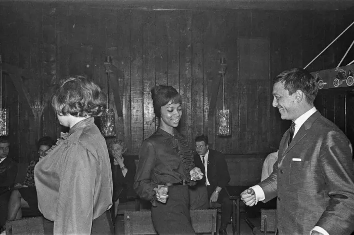 Framed Print : Playboy, film maker and night club owner Rolf Eden, seen here dancing with one of Framed Print : Playboy, film maker and night club owner Rolf Eden, seen here dancing with one of