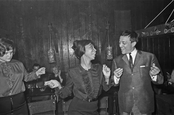 Framed Print : Playboy, film maker and night club owner Rolf Eden, seen here dancing with one of Framed Print : Playboy, film maker and night club owner Rolf Eden, seen here dancing with one of