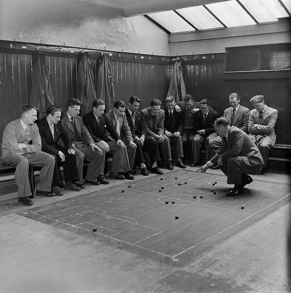 Players of Southampton Football club are given tactical instruction by the manager in