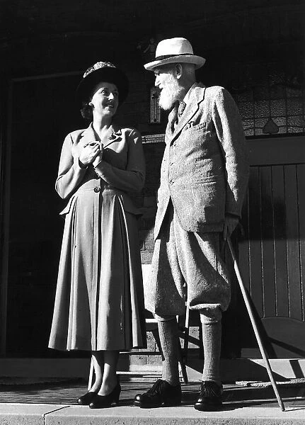 Playwright George Bernard Shaw visited by Miss Frances Rowe who came to offer him an