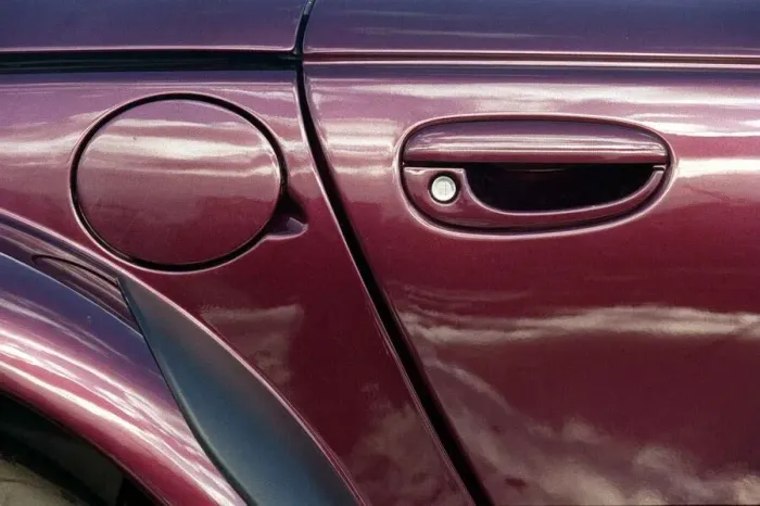 Framed Print : Plymouth Prowler October 1998 Detail of pertol filler lid door handle lock Framed Print : Plymouth Prowler October 1998 Detail of pertol filler lid door handle lock