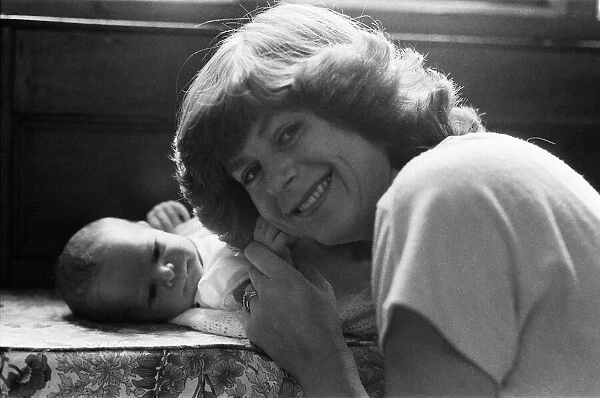 Poet Pam Ayres is pictured with her newborn baby James. 3rd August 1984