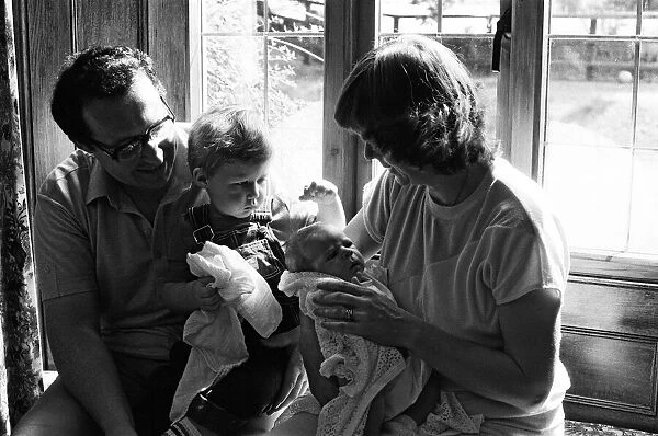 Poet Pam Ayres is pictured with her newborn baby James, son William