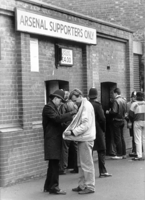 Framed Print : Police checking a fans jacket outside Highbury. 5th March 1990 Framed Print : Police checking a fans jacket outside Highbury. 5th March 1990