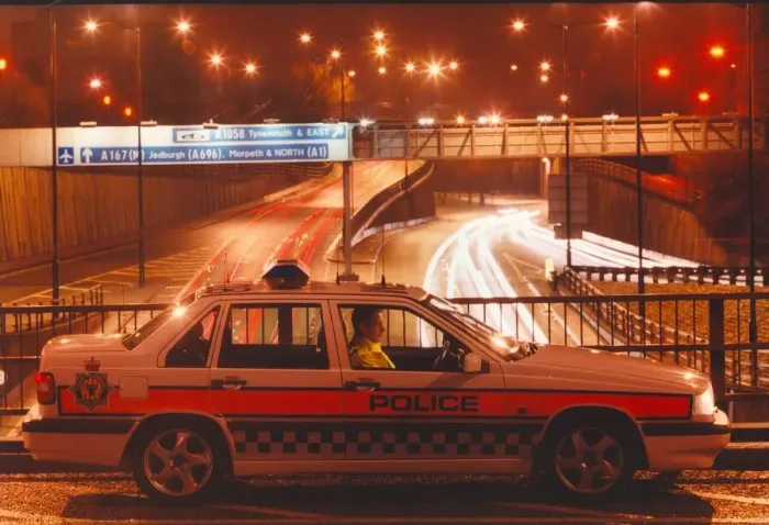 Framed Print : A police officer watches the traffic whizz by in his patrol car 01  /  06  /  95 circa