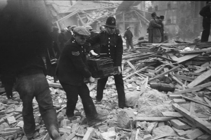 Framed Print : Police officers recover a cash register following a V2 attack on Sidmouth Street