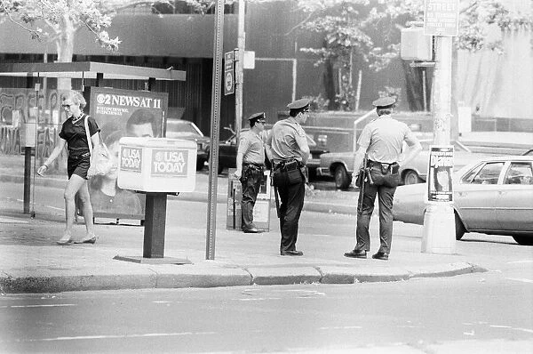 Police Officers standing on street corner, New York, USA, June 1984, also pictured