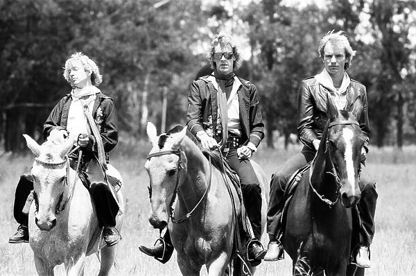 The Police, pop  /  rock group, pictured on horses. Left is guitarist Andy