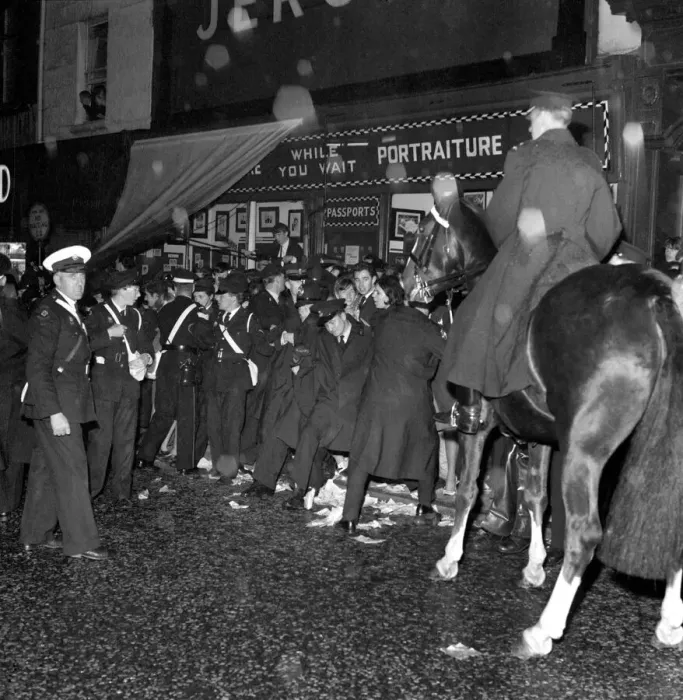 Framed Print : Police try to control fans in the streets of Liverpool before the premiere of the Beatles