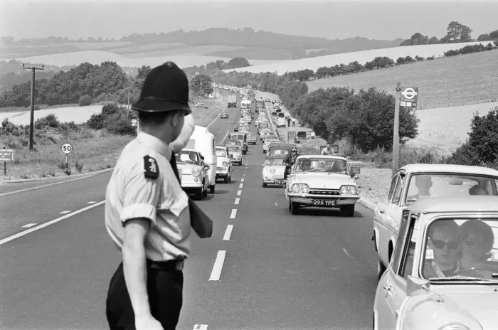 Framed Print : Policeman directing August Bank Holiday taffic on the A20