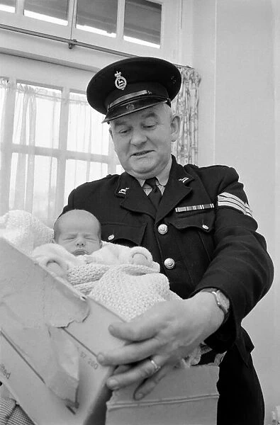 A policeman with a new born baby. December 1969 Z11742
