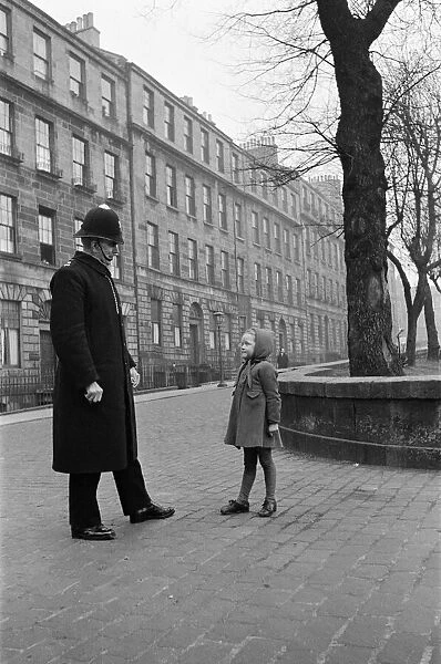A policeman talking to a small girl, Edinburgh, 1945