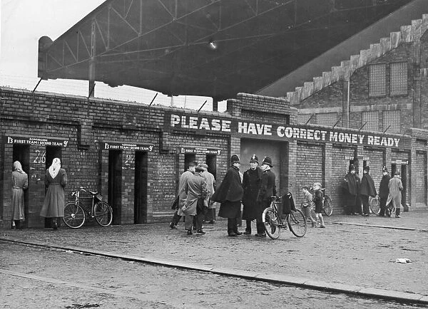 Policemen on duty outside Maine Road stadium in Manchester to deal with crowds queuing