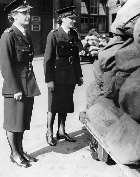 Two policewomen on duty in Cardiff during the Second World War. Mrs D. M