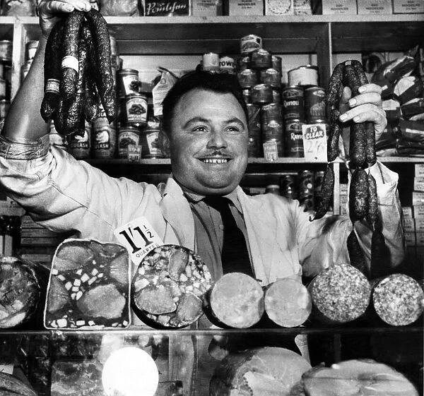 Polish born Jan Zygadlo at his delicatessen stall in the market. 26th September 1958