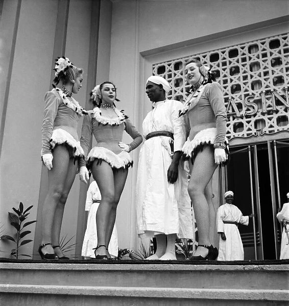 Politician Berber Pasha (Thamilel Galoui) meets women dancers on the steps of the Casino